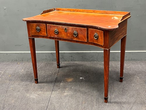 Lot 556 - A 19th century mahogany washstand with shaped...