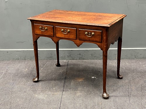 Lot 574 - An oak lowboy containing 18th century elements,...