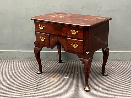 Lot 575 - A George III and later mahogany lowboy, with...