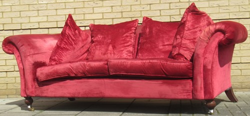 Lot 636 - A Chesterfield style red velvet type sofa, on...