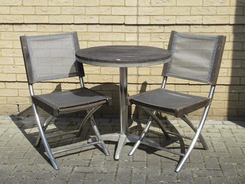 Lot 686 - A John Lewis garden table with wooden top and...