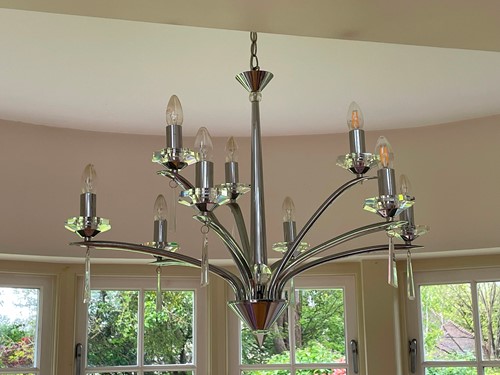 Lot 671 - A modern design chrome finish nine arm ceiling...