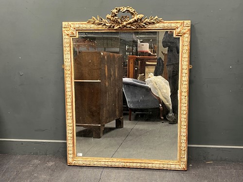 Lot 455 - A Empire style gilt and gesso wall mirror,...