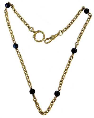 Lot 234 - A watch chain spaced with lapis lazuli beads
