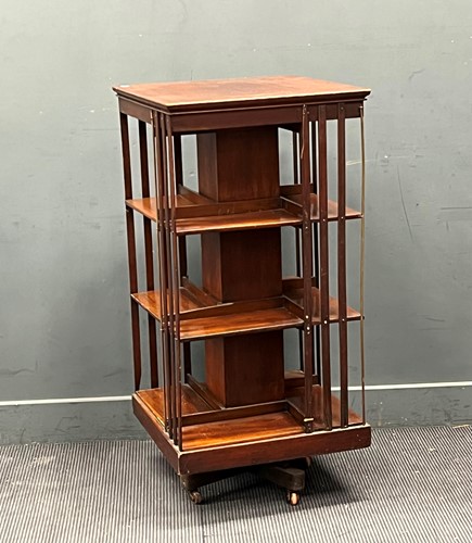 Lot 406 - An Edwardian revolving bookcase 117 x 57 x 57cm