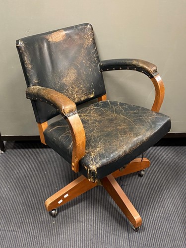 Lot 442 - An leather office swivel chair