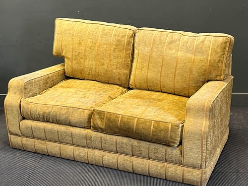 Lot 320 - A modern upholstered two seat sofa with shaped...