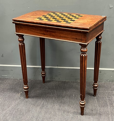 Lot 396 - A Victorian mahogany games table with foldover...