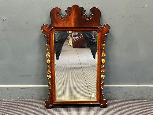 Lot 394 - A George III style walnut fret carved wall...
