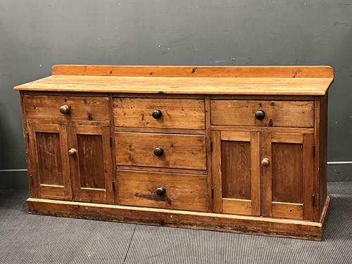 Lot 451 - A late Victorian stripped pine dresser base,...