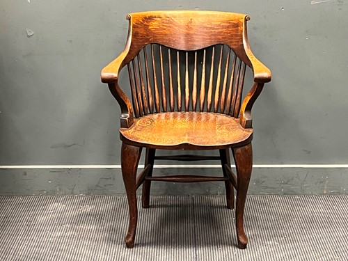 Lot 380 - An Edwardian spindle back desk chair with...