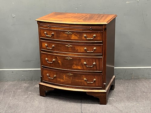 Lot 403 - A George III style mahogany bow front chest...