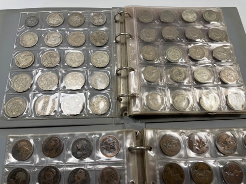 Lot 336 - Two albums of silver and copper coinage,...