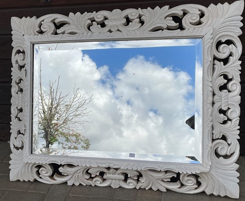 Lot 644 - A pierced frame white painted wall mirror,...