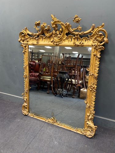 Lot 323 - A 19th century gilt gesso ‘rococo’ overmantel...