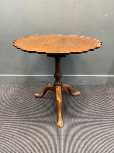 Lot 348 - A George III style mahogany tripod wine table,...