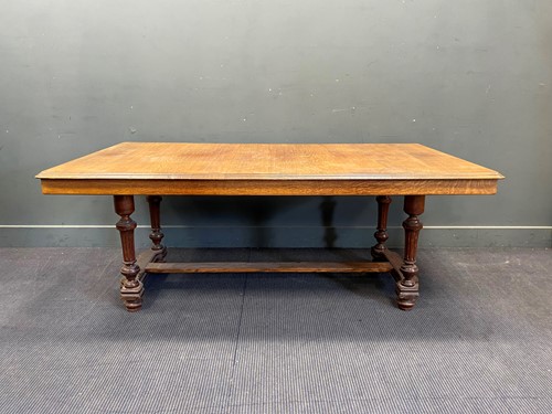 Lot 816 - An Edwardian carved oak dining table, on...