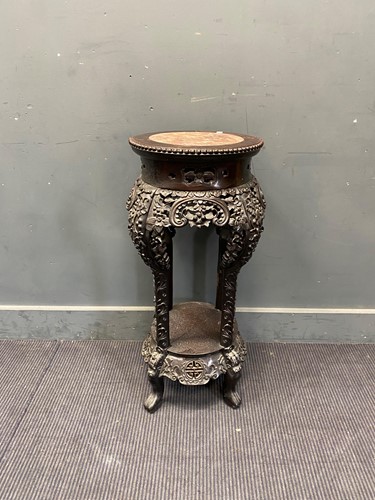 Lot 333 - A Far Eastern carved ‘prunus’ ebonised...