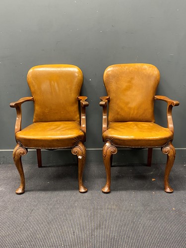 Lot 285 - A pair of cabriole leg leather desk chairs in...