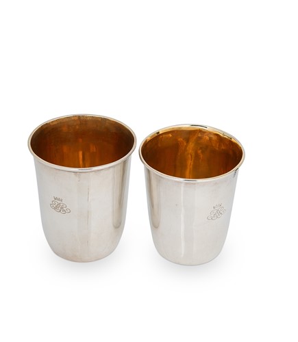 Lot 300 - A near pair of George III silver beakers