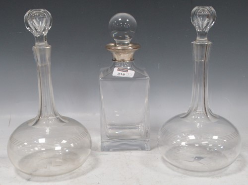 Lot 318 - A whisky decanter with silver collar together...