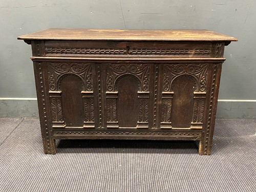 Lot 381 - A carved oak coffer, 18th century, the two...