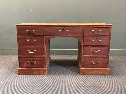 Lot 363 - A mahogany desk, seven drawers on one side and...