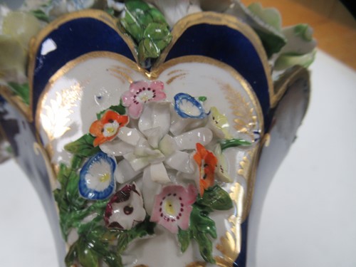 Lot 1 - A pair of Davenport blue and gilt rams head...