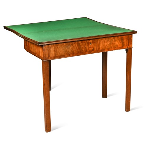 Lot 455 - A George III mahogany fold over games/writing table
