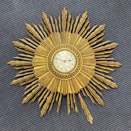 Lot 298 - Giltwood sunburst clock 58cms Diam
