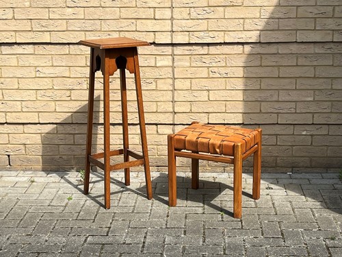 Lot 371 - An Arts & Crafts oak plant stand 94 x 31 x...