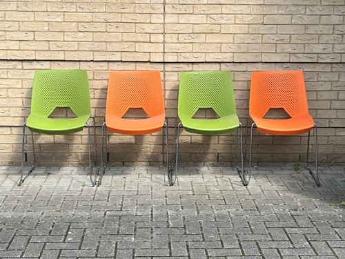 Lot 372 - Two pairs of plastic and chrome dining chairs...