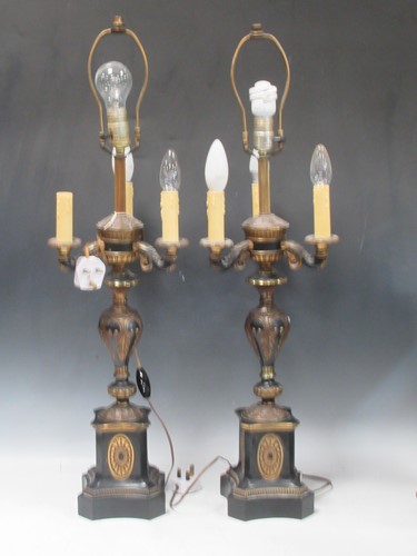 Lot 139 - A pair of Empire style three branch lamps,...