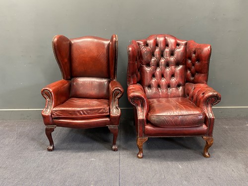 Lot 356 - Two red leather club wingback armchairs