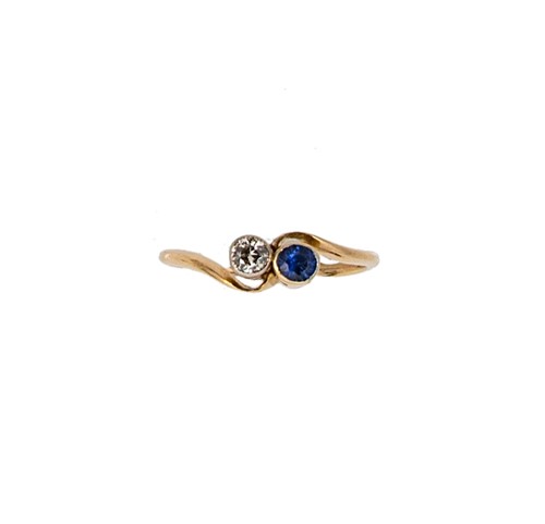 Lot 55 - A sapphire and diamond crossover ring