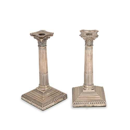 Lot 328 - A pair of George V silver candlesticks