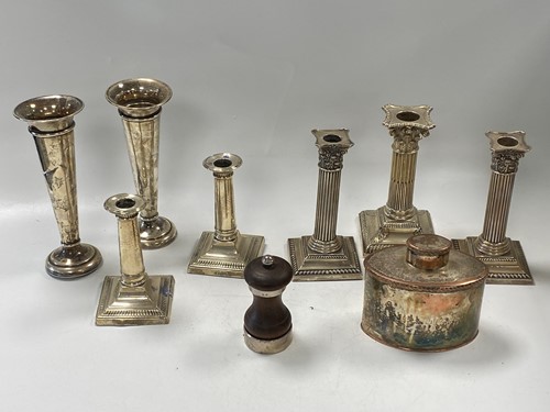 Lot 374 - Two pairs of silver candlesticks together with...