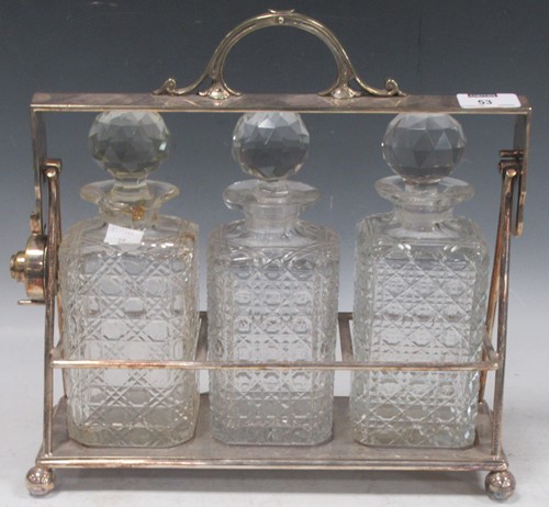 Lot 53 - A silver plated tantalus with three square...