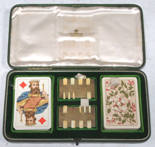 Lot 126 - A leather cased set of playing cards by...