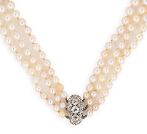 Lot 85 - A triple row pearl necklace with a diamond clasp