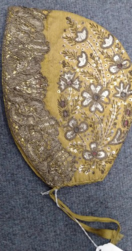 Lot 276 - An 18th century embroidered bonnet,...