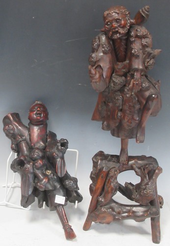 Lot 78 - A Chinese root carving of an elder, 50cm high;...