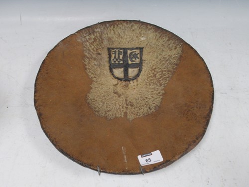Lot 65 - A stoneware Studio pottery dish with heraldic...