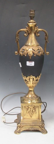 Lot 140 - An Empire style vase lamp in black and gilt,...