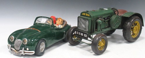 Lot 146 - Modern resin model of a couple in a dark green...