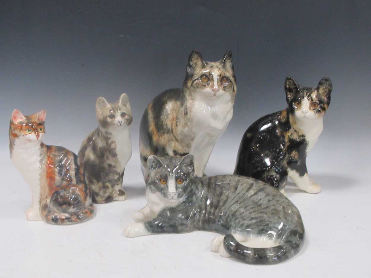 Lot 117 - A group of three Winstanley pottery cats,...