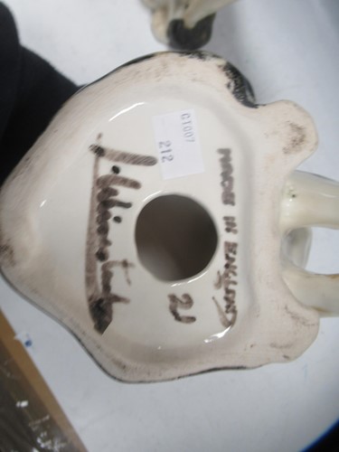 Lot 117 - A group of three Winstanley pottery cats,...