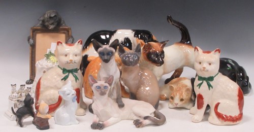 Lot 119 - A group of mainly 20th century decorative cat...