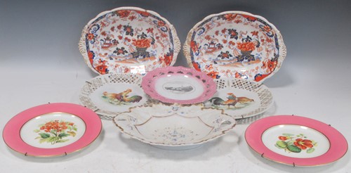 Lot 102 - A pair of botanical plates the central floral...