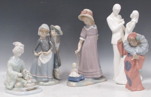 Lot 66 - Ceramic figures by Lladro, child pulling a...